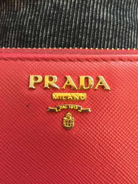 how can i tell real or fake prada wallet|prada purse fake.